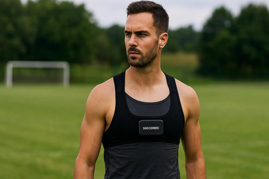A fit male athlete wearing a SOCCERBEE-X GPS tracker vest stands on a soccer field, highlighting the vest’s breathable chest-open design and outdoor use.