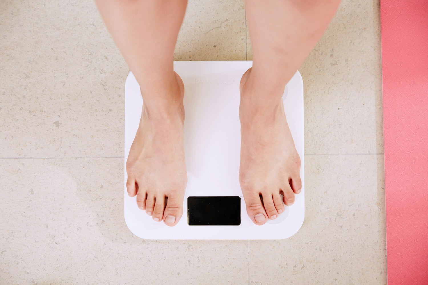 Digital-fitness-scale-measuring-weight,-body-fat,-and-BMI